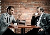 8726974-coffee-and-conversation-between-two-well-dressed-men